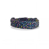 Dog collar in Barklin Eighties Sugar pattern, standard 2.5 cm width, shown in back arc view to highlight the continuous printed textile pattern and structured collar shape.